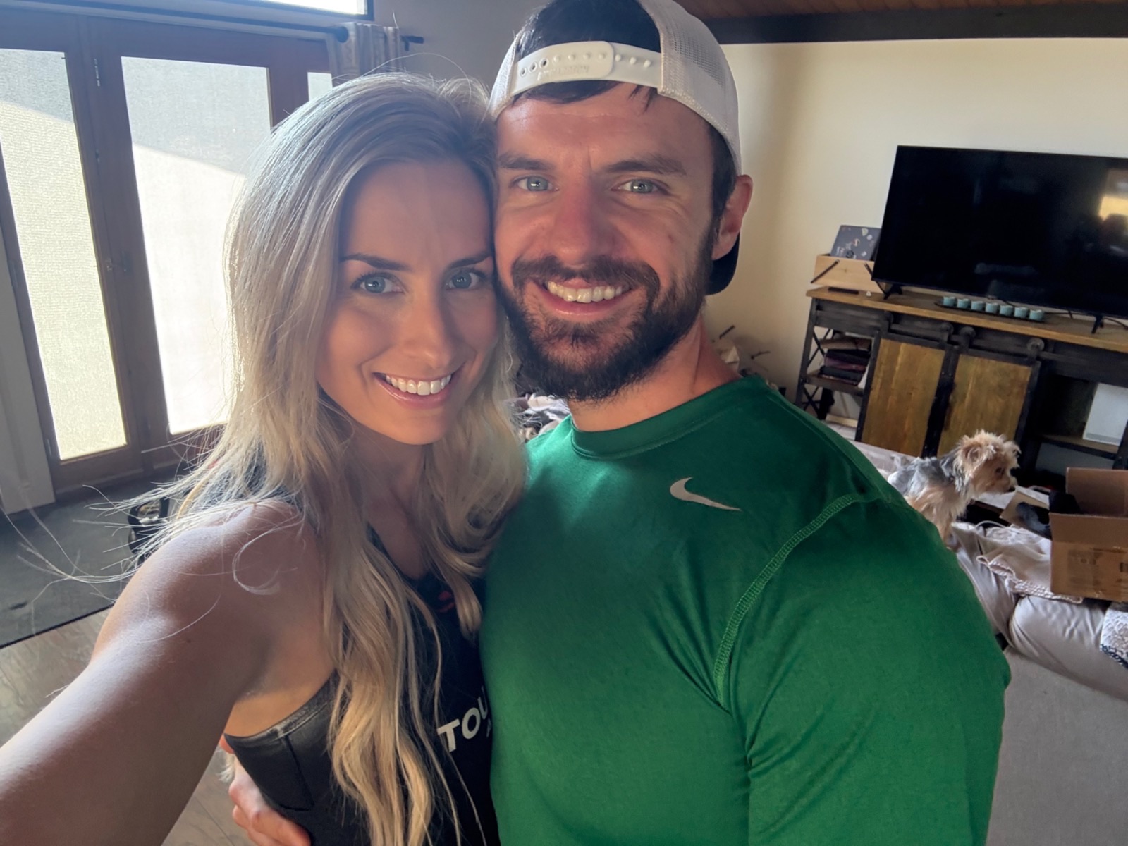 Brooke and Andrew smiling together at home.